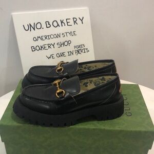 Gucci Black Loafers with Gold Accent